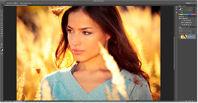 young woman portrait in yellow autumn field. Image licensed from Shutterstock by Photoshop Essentials