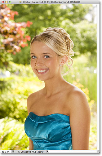 A photo of a teenage girl in a blue dress. Image licensed from Fotolia by Photoshop Essentials.com