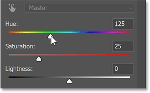 Dragging the slider to select a green hue.