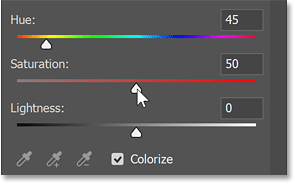 Dragging the Saturation slider.