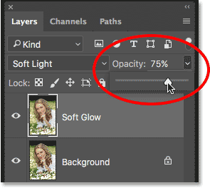 Lowering the opacity of the Soft Glow layer. Image © 2016 Photoshop Essentials.com