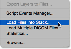 Selecting the Load Files into Stack script under the File menu. Image © 2015 Photoshop Essentials.com