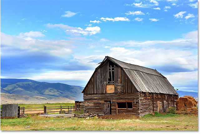 Barn backed by mountains. Image 113710336 licensed from Adobe Stock by Photoshop Essentials.com