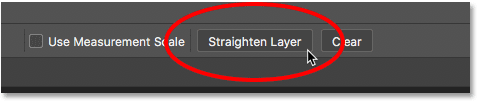 Clicking the Straighten Layer button in the Options Bar. Image © 2016 Photoshop Essentials.com