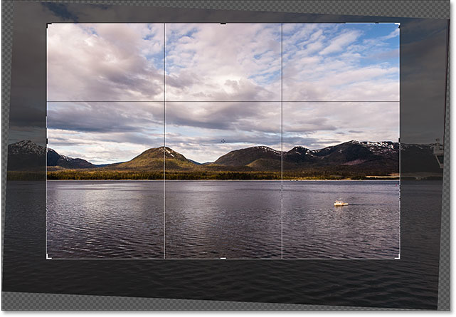 Resizing the crop border and repositioning the image. Image © 2016 Photoshop Essentials.com