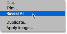 Choosing the Reveal All command from the Image menu in Photoshop