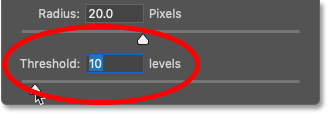 Increasing the Unsharp Mask threshold value to 10 levels