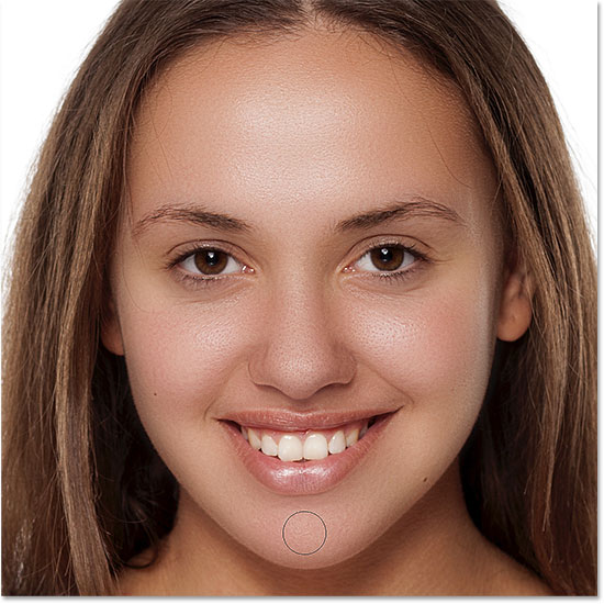 Smoothing the skin in the lower areas of the woman's face in Photoshop