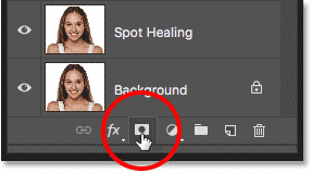 Clicking the Add Layer Mask icon in the Layers panel in Photoshop