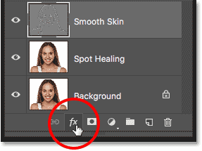 Clicking the Layer Styles icon in the Layers panel in Photoshop