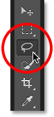 Selecting the Lasso Tool from the Tools panel in Photoshop. Image © 2016 Photoshop Essentials.com