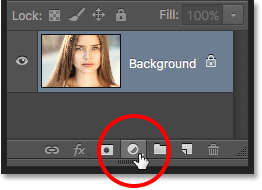 Clicking the New Fill or Adjustment Layer icon in the Layers panel. Photoshop. Image © 2016 Photoshop Essentials.com