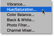 Selecting a Hue/Saturation adjustment layer. Photoshop. Image © 2016 Photoshop Essentials.com