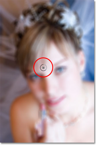 An initial pin appears on the image with Field Blur selected in the Blur Gallery. Image © 2012 Photoshop Essentials.com