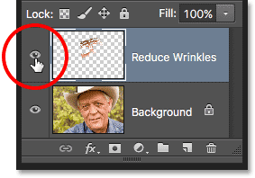 Clicking the visibility icon for the Reduce Wrinkles layer. Image © 2016 Photoshop Essentials.com