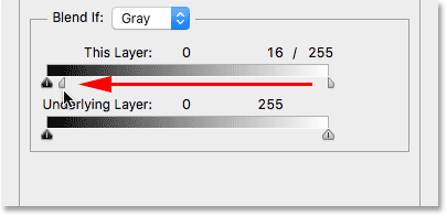 Dragging the left half of the Blend If slider towards the left. Image © 2016 Steve Patterson, Photoshop Essentials.com