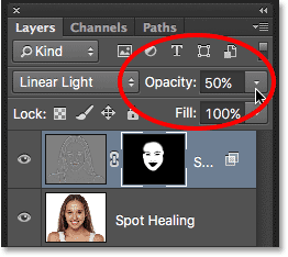 Lowering the opacity of the skin softening effect to 50 percent. Image © 2016 Steve Patterson, Photoshop Essentials.com