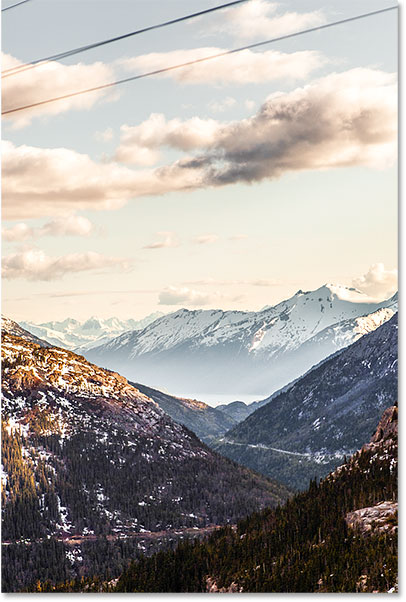 A photo of mountains with unwanted wires along the top. 