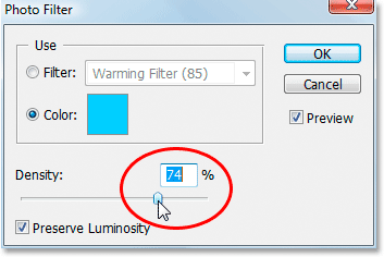 Dragging the Density slider to the right to correct the color cast.