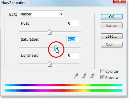 Dragging the Saturation slider to boost the colors in the image.