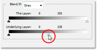 Dragging the bottom white point Blend If slider towards the left