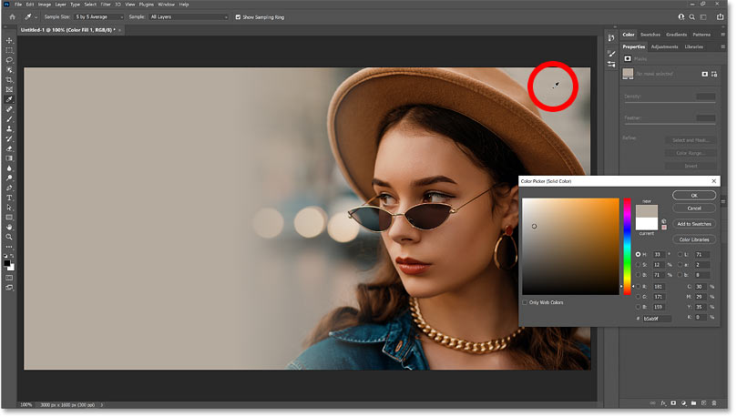 Sampling a color from the upper right of the image to use as the background color in Photoshop