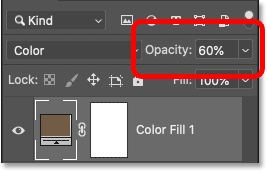 Blending the fill layer color with the image by lowering its opacity in Photoshop's Layers panel