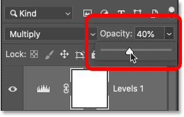 Lowering the opacity of the Levels adjustment layer. 