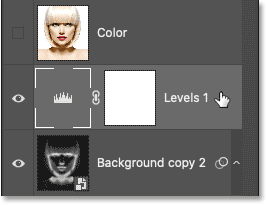 Selecting the Levels adjustment layer in Photoshop's Layers panel