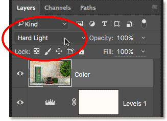 Changing the blend mode to Hard Light. 