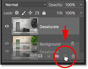 Dragging the Desature layer onto the New Layer icon. 