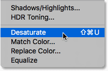 Choosing the Desaturate command from under the Image menu. 