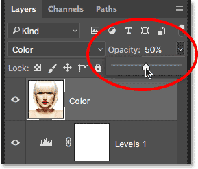 Lowering the opacity of the Color layer. 