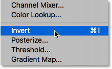 Selecting the Invert command in Photoshop. 