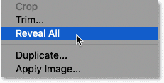 Choosing the Reveal All command from the Image menu in Photoshop