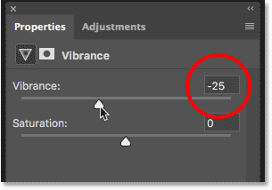 Dragging the Vibrance slider to reduce color saturation