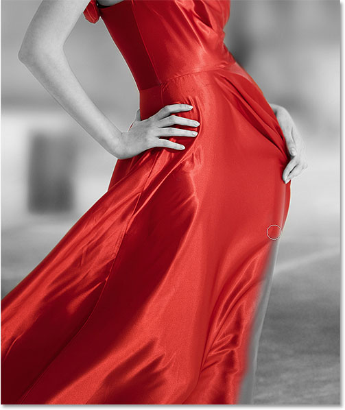 Continuing around the edges of the dress to reveal the color. Image © 2015 Photoshop Essentials.com.