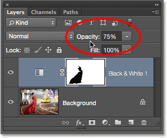 Lowering the opacity of the adjustment layer. 