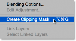 Choosing Create Clipping Mask from the Layers panel menu. Image © 2015 Photoshop Essentials.com.