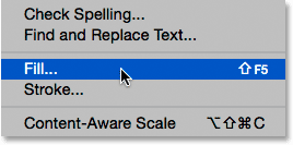 Selecting the Fill command from under the Edit menu. Image © 2015 Photoshop Essentials.com.