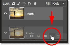 Dragging the Photo layer onto the New Layer icon in the Layers panel