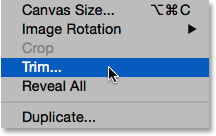 Selecting the Trim command from under the Image menu.