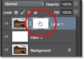 Clicking the layer mask thumbnail in the Layers panel.