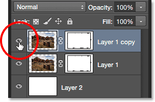 Clicking the top layer's visibility icon.