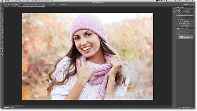 The photo opens in a separate tabbed document. Image © 2014 Photoshop Essentials.com.