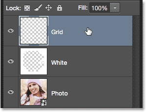 Selecting the Grid layer in the Layers panel. Image © 2014 Photoshop Essentials.com.