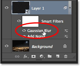 Double-clicking on the Gaussian Blur Smart Filter to re-open it.