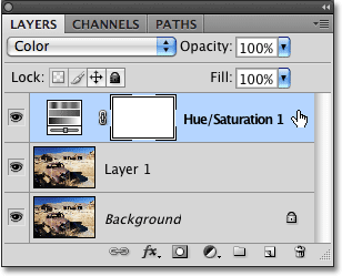 Selecting the adjustment layer in the Layers panel in Photoshop CS4.