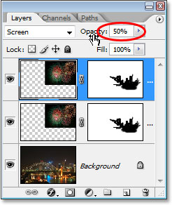 Lowering the opacity of the duplicate layer.