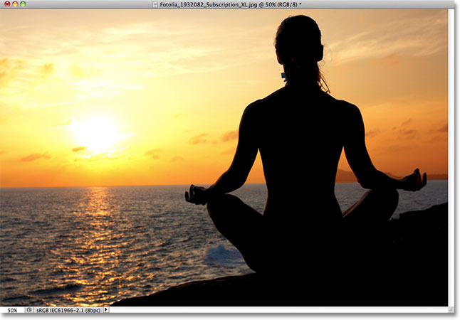 A woman meditating at sunset. Image licensed from Fotolia by Photoshop Essentials.com.